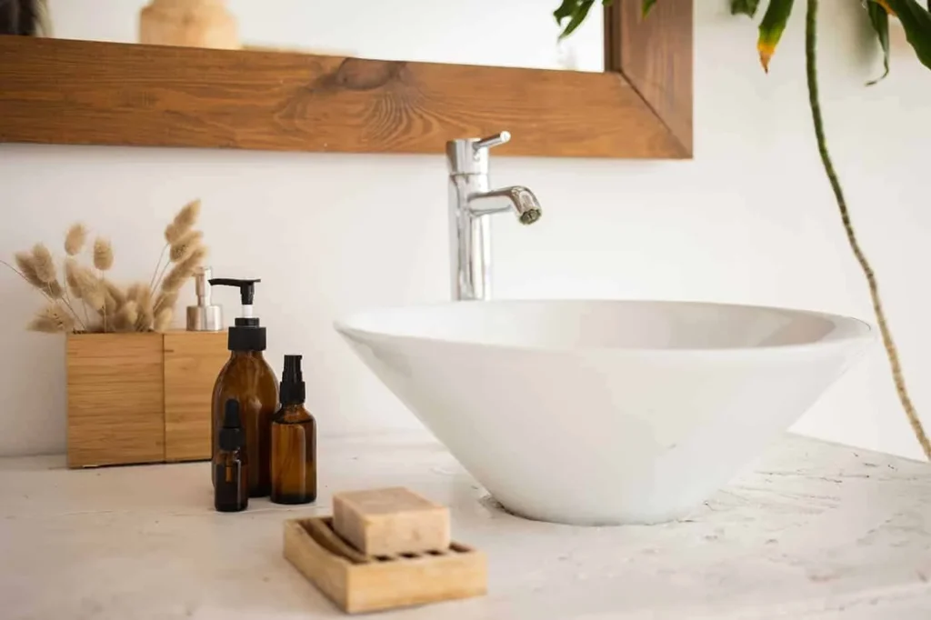Brown glass skincare bottles next to a bar of soap